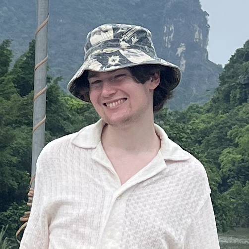 Portrait of Lachlan smiling on a bridge